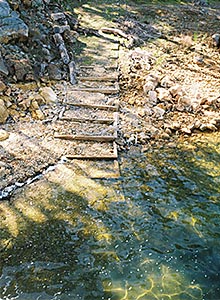 pebble staircase trailing into water