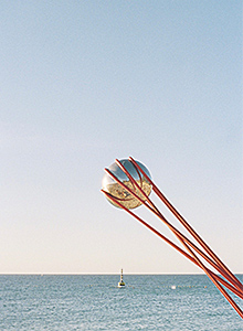 sculpture with sky and ocean